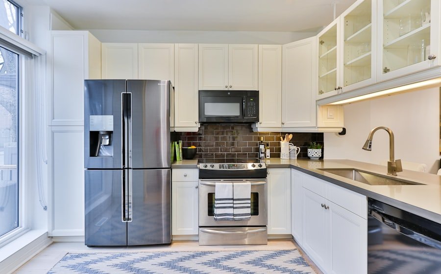 Stainless side-by-side refrigerator in a fitted kitchen